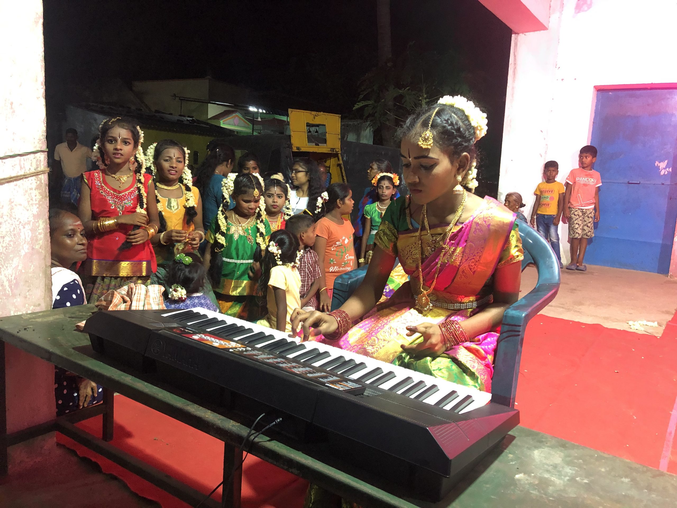 Girl playing piano music kids Isai Ragam Auroville India