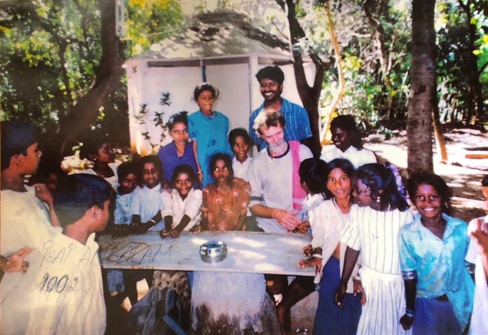 Dutch Ivar Jenten at the table with the children in Auroville India 2001